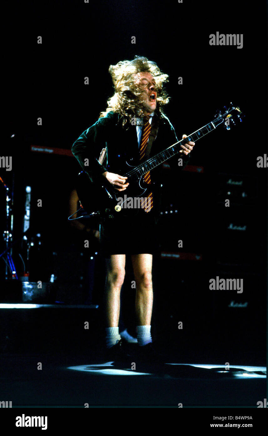 Angus Young of metal band AC DC in concert at Wembley Arena Stock Photo ...