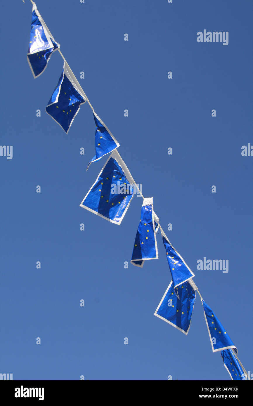many european union flags flying in wind in sun Stock Photo - Alamy