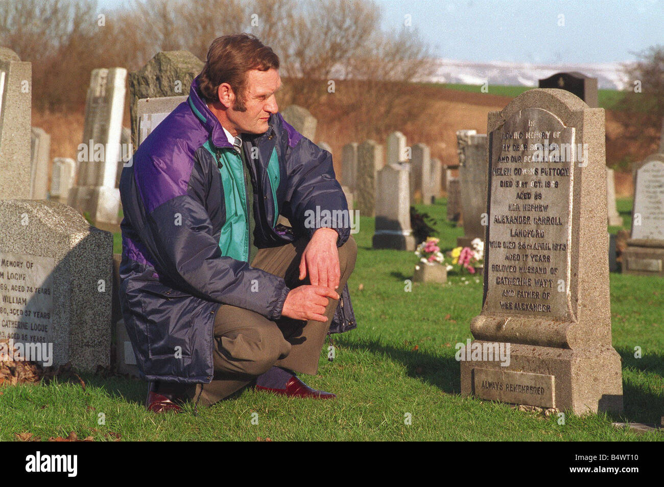 George Puttock kneeling beside the grave of his wife Helen Puttock murder victim Bible John Bible John Stock Photo