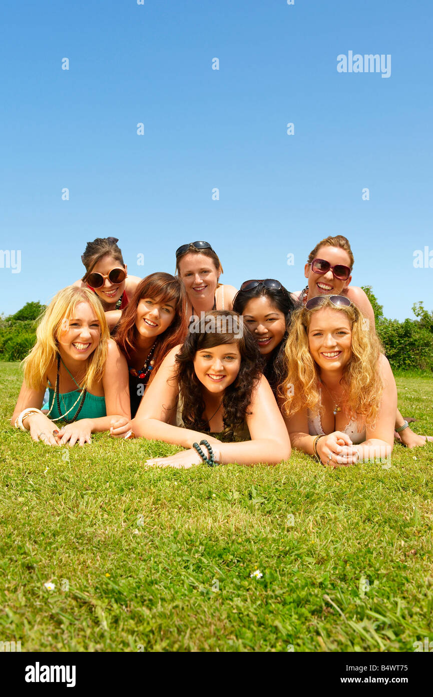 Portrait of eight women lying down Stock Photo