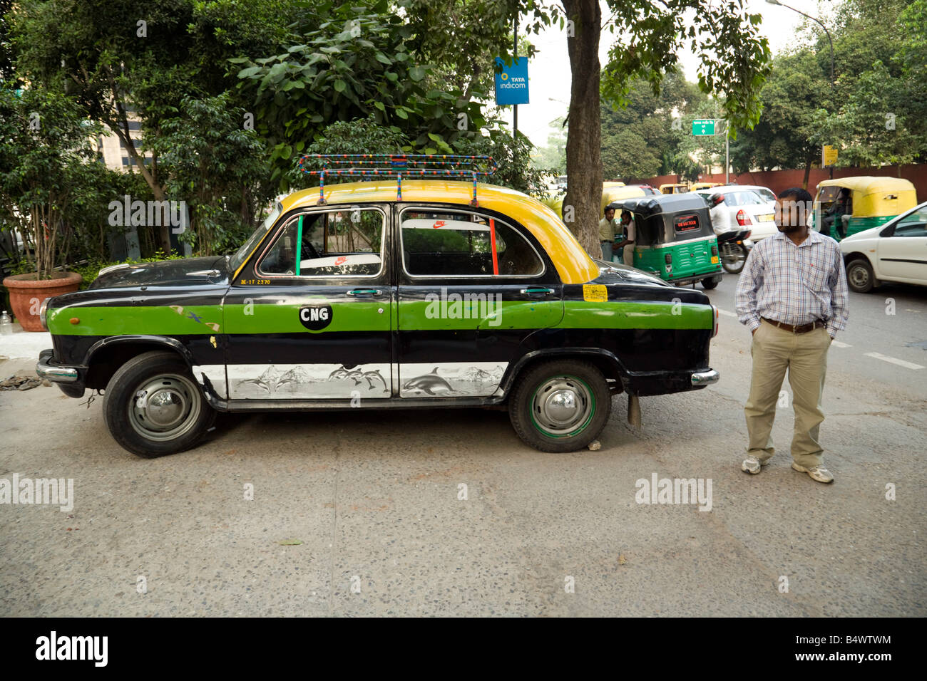 A taxi cab driver and his taxi, New Delhi, india Stock Photo