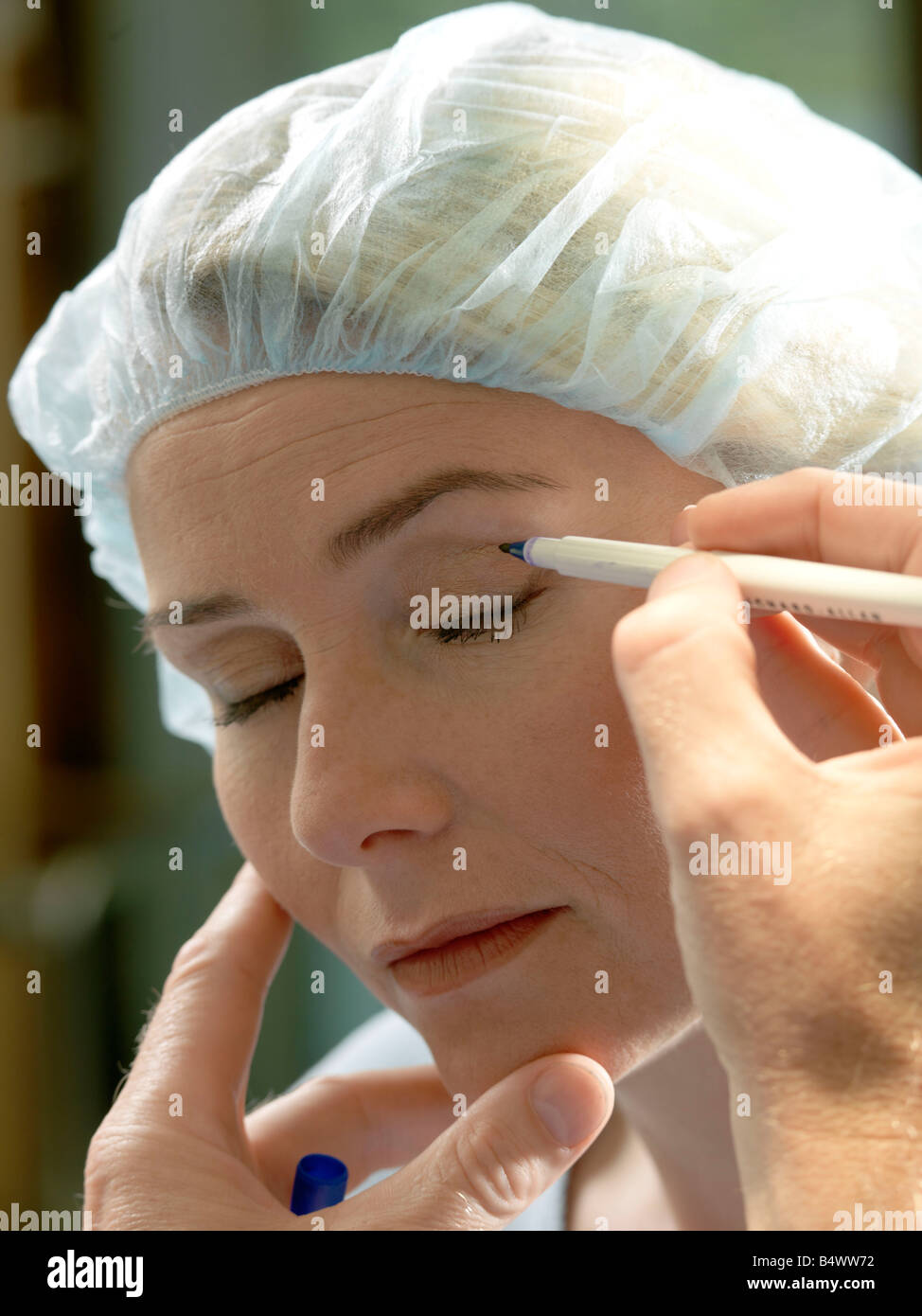 Doctor preparing patient for surgery Stock Photo