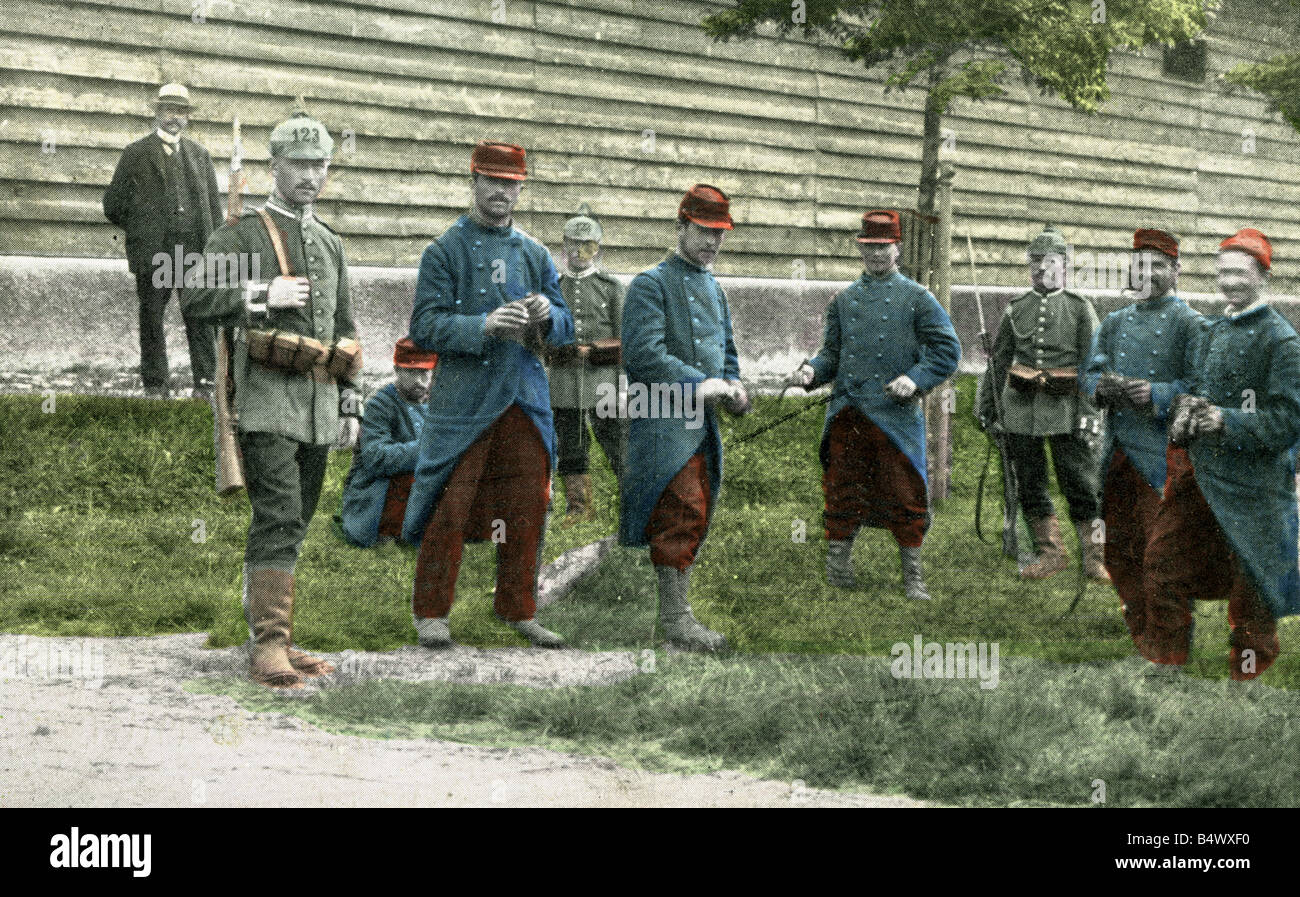 events, First World War / WWI, prisoners of war, French soldiers and German guards, photo postcard, coloured, circa 1914, Stock Photo
