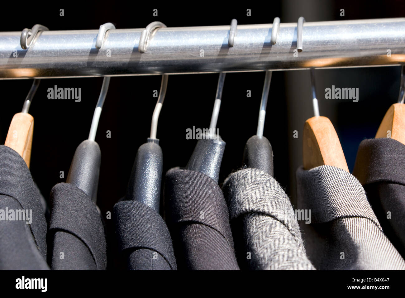 A rack of old used men's jackets Stock Photo - Alamy