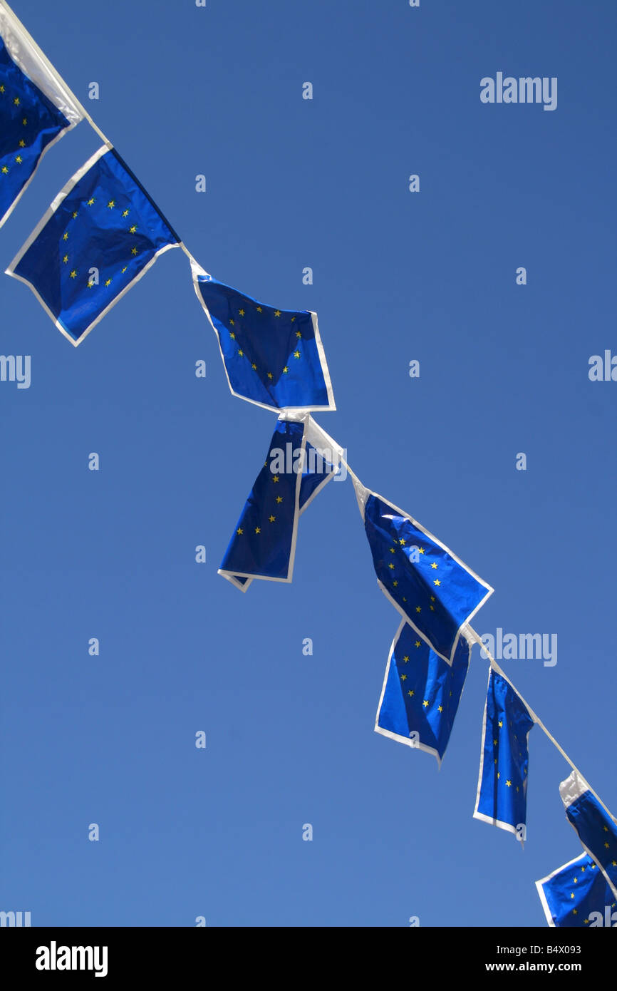 many european union flags flying in wind in sun Stock Photo - Alamy