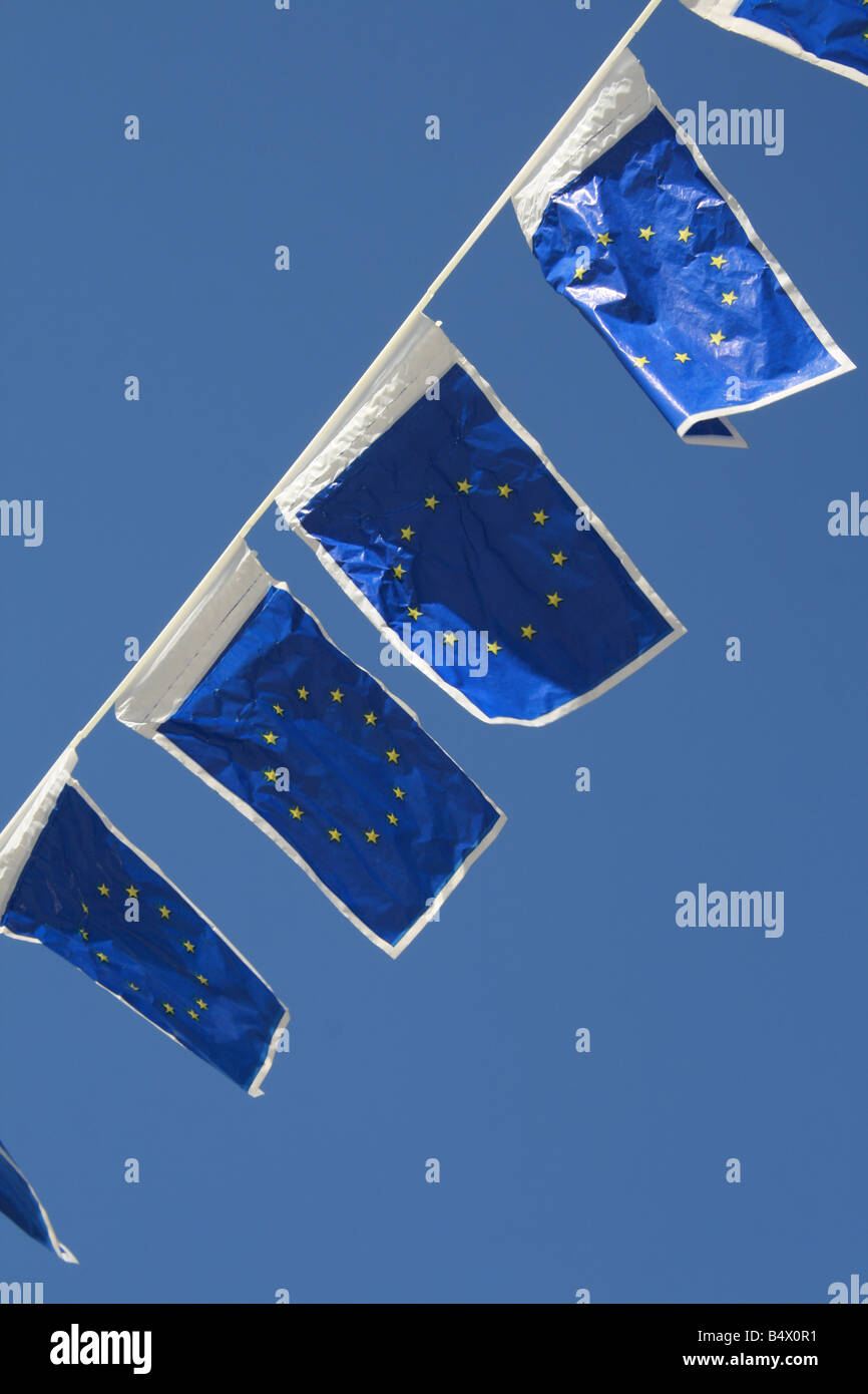 many european union flags flying in wind in sun Stock Photo - Alamy