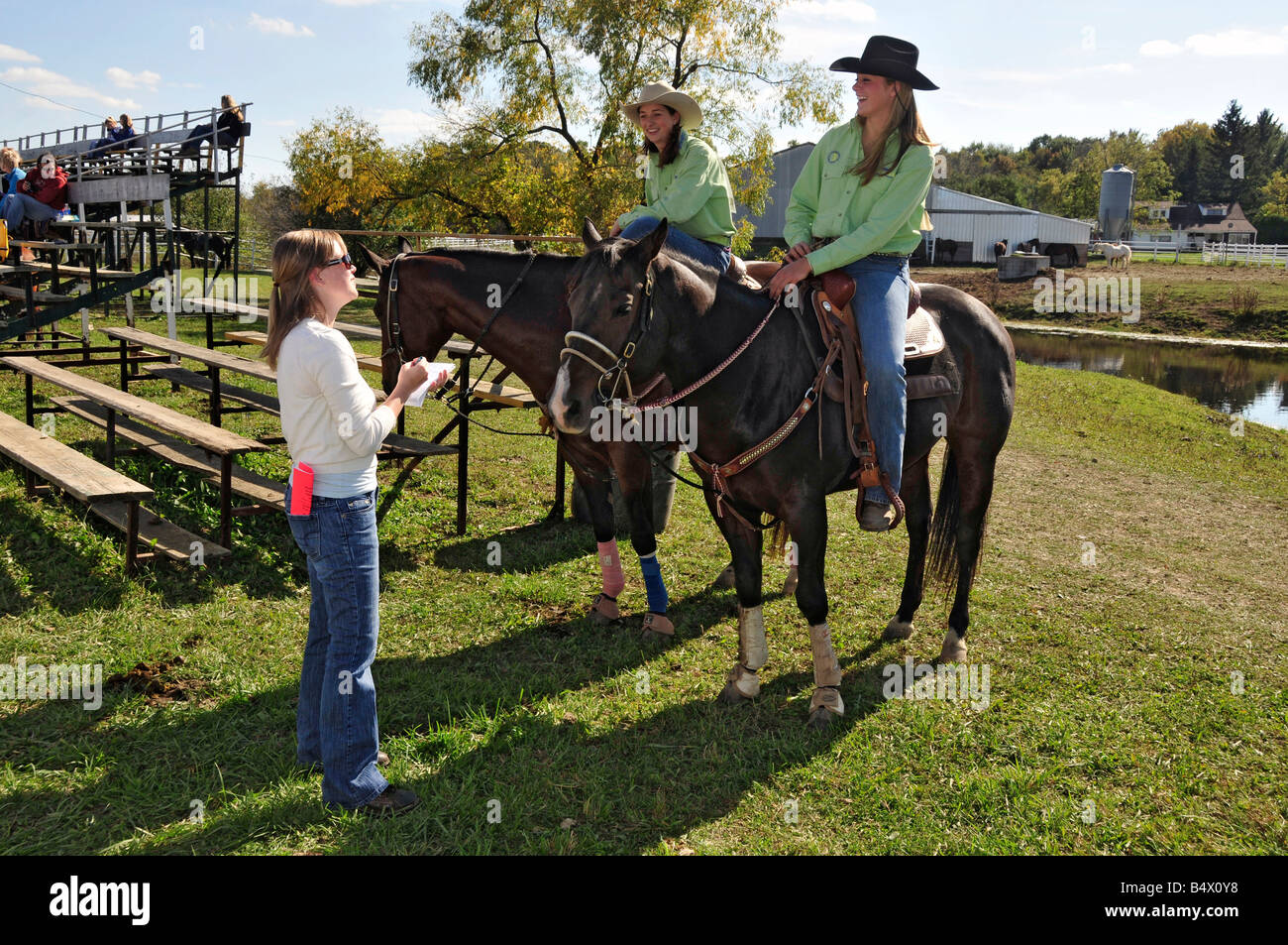 High school girls are interviewed for newspaper for rodeo competition Stock Photo