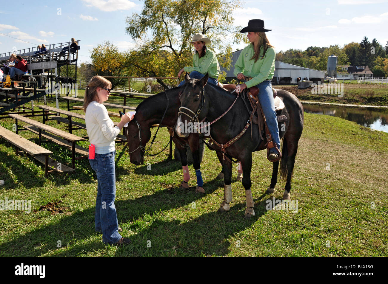 High school girls are interviewed for newspaper for rodeo competition Stock Photo