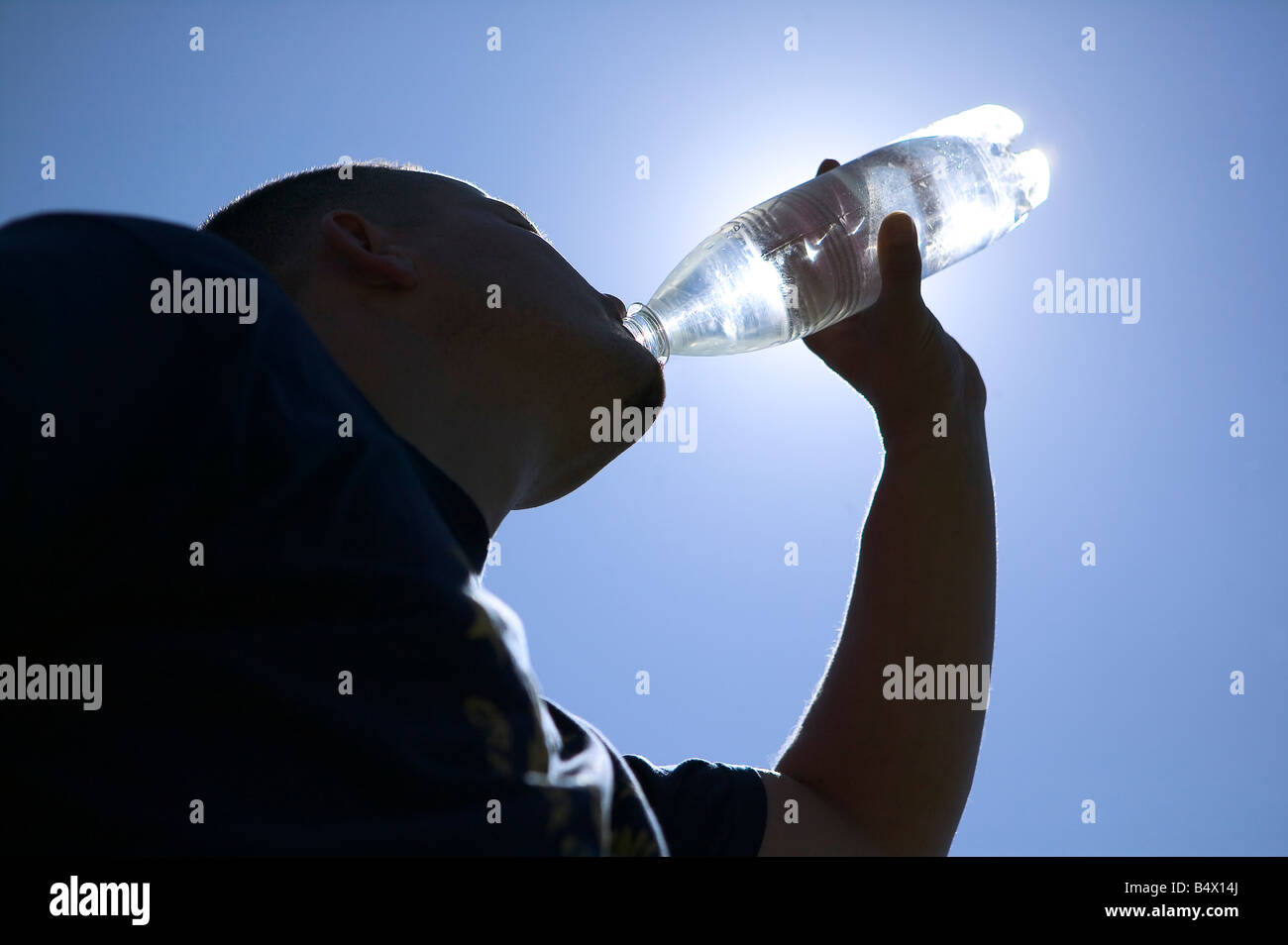 man drinking water bottle sky Stock Photo