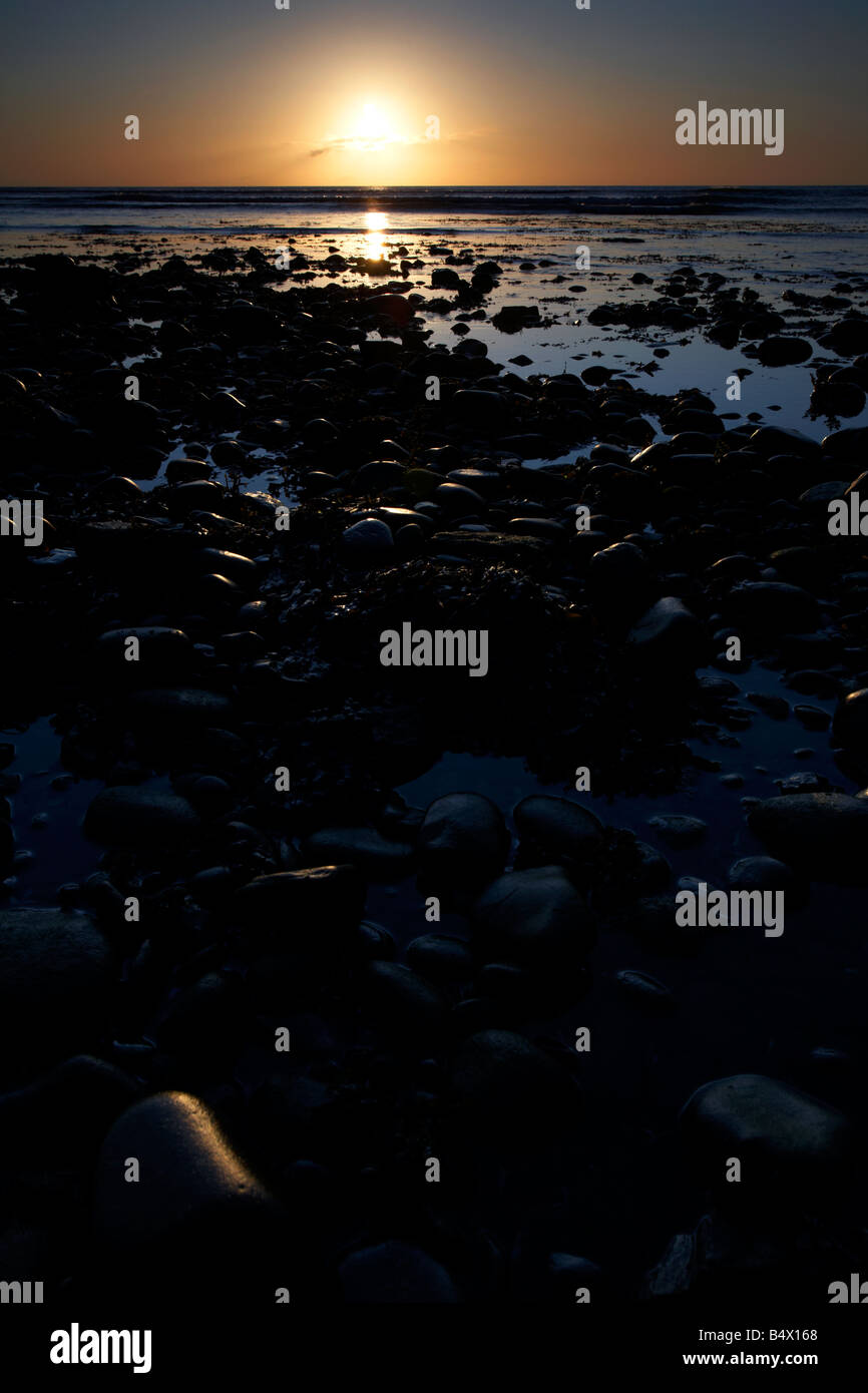 stony beach at sunrise over the irish sea newcastle county down