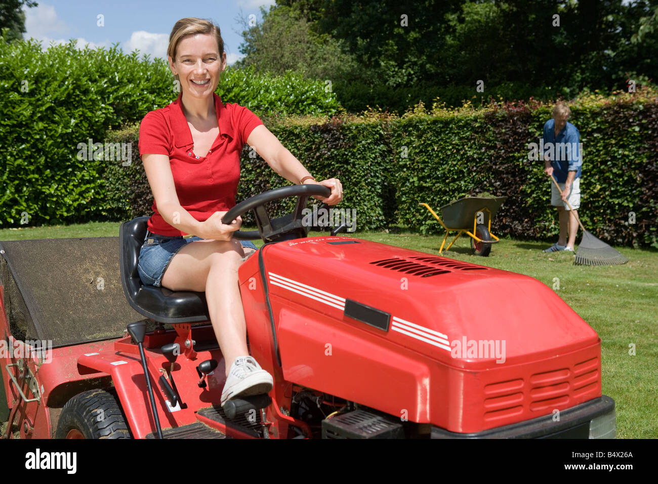 Mature Lady Mowing Lawn High Resolution Stock Photography and Images
