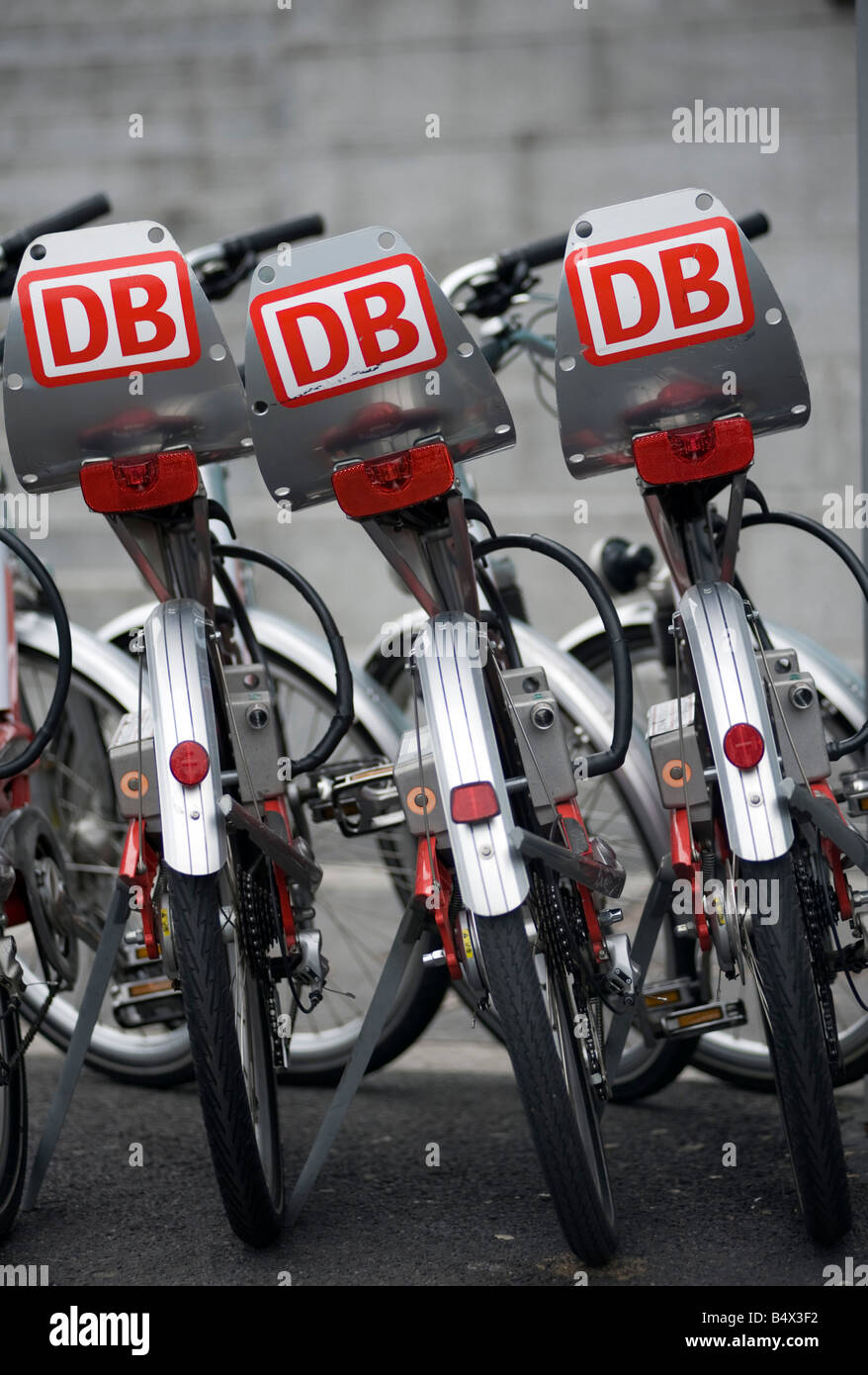 Bicycles for hire lined up in Berlin The bikes are operated by DB or Deutsche Bahn  and can be unlocked and hired by credit card Stock Photo