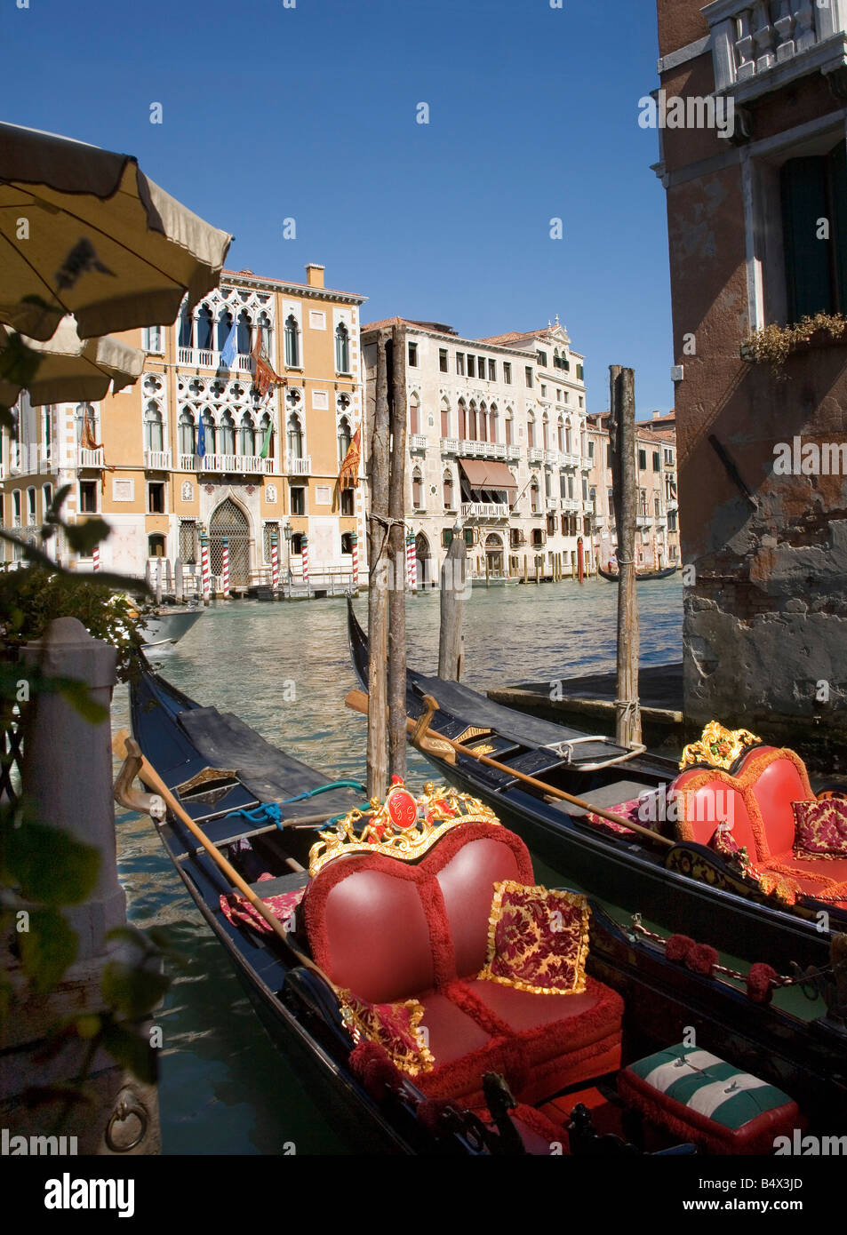 Gondolas moored on the Grand Canal in Venice Stock Photo