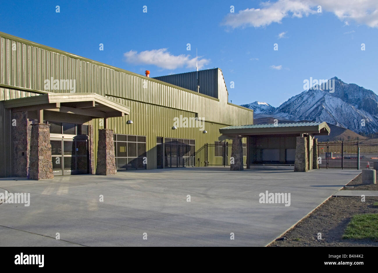 New Mammoth Lakes CA Air Terminal building at enlarged Mammoth Lakes Airport Sunset on October 12 2008 Stock Photo