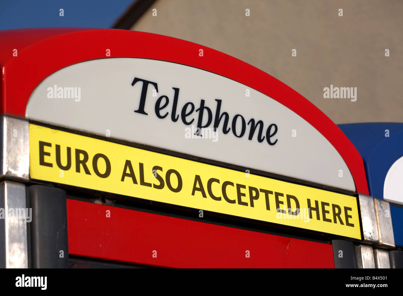 BT telephone phone box with euro also accepted here sign in newcastle county down northern ireland uk Stock Photo