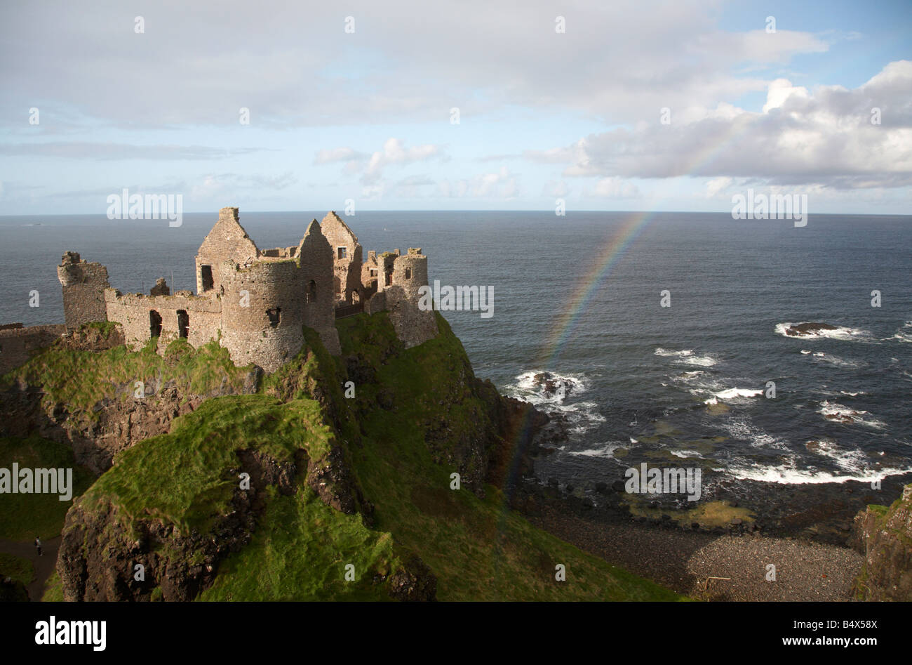 dunluce castle with rainbow and the north antrim coastline county