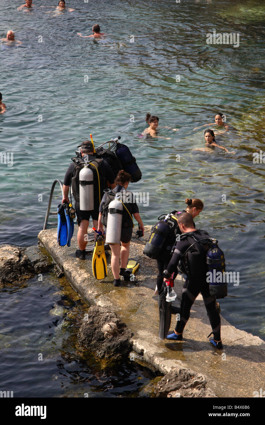 A Diving Party arrives at Ghar Lapsi bay in Malta. Stock Photo