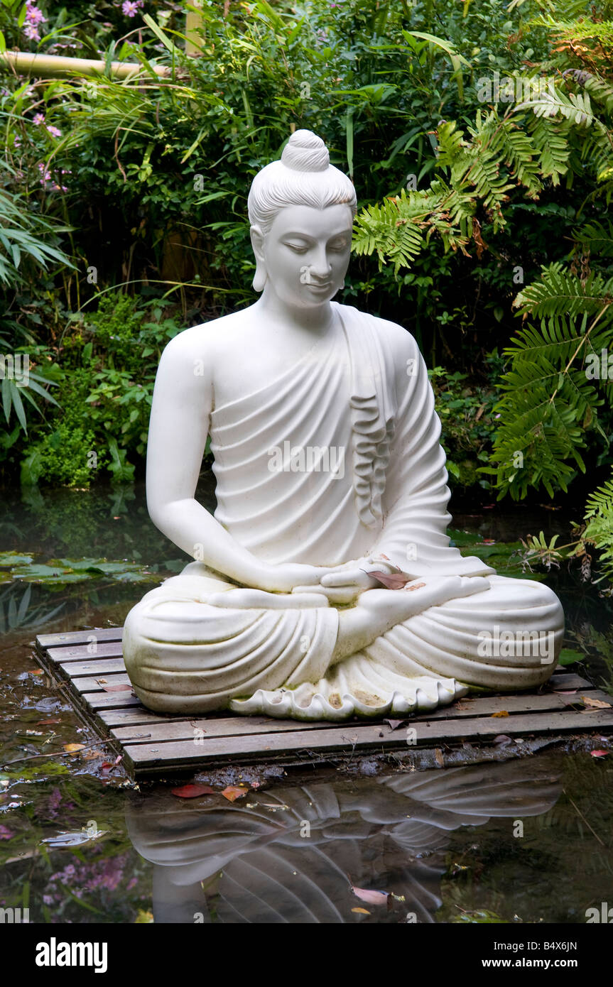 asian style female statue in tropical garden, gardone, lake garda, italy Stock Photo