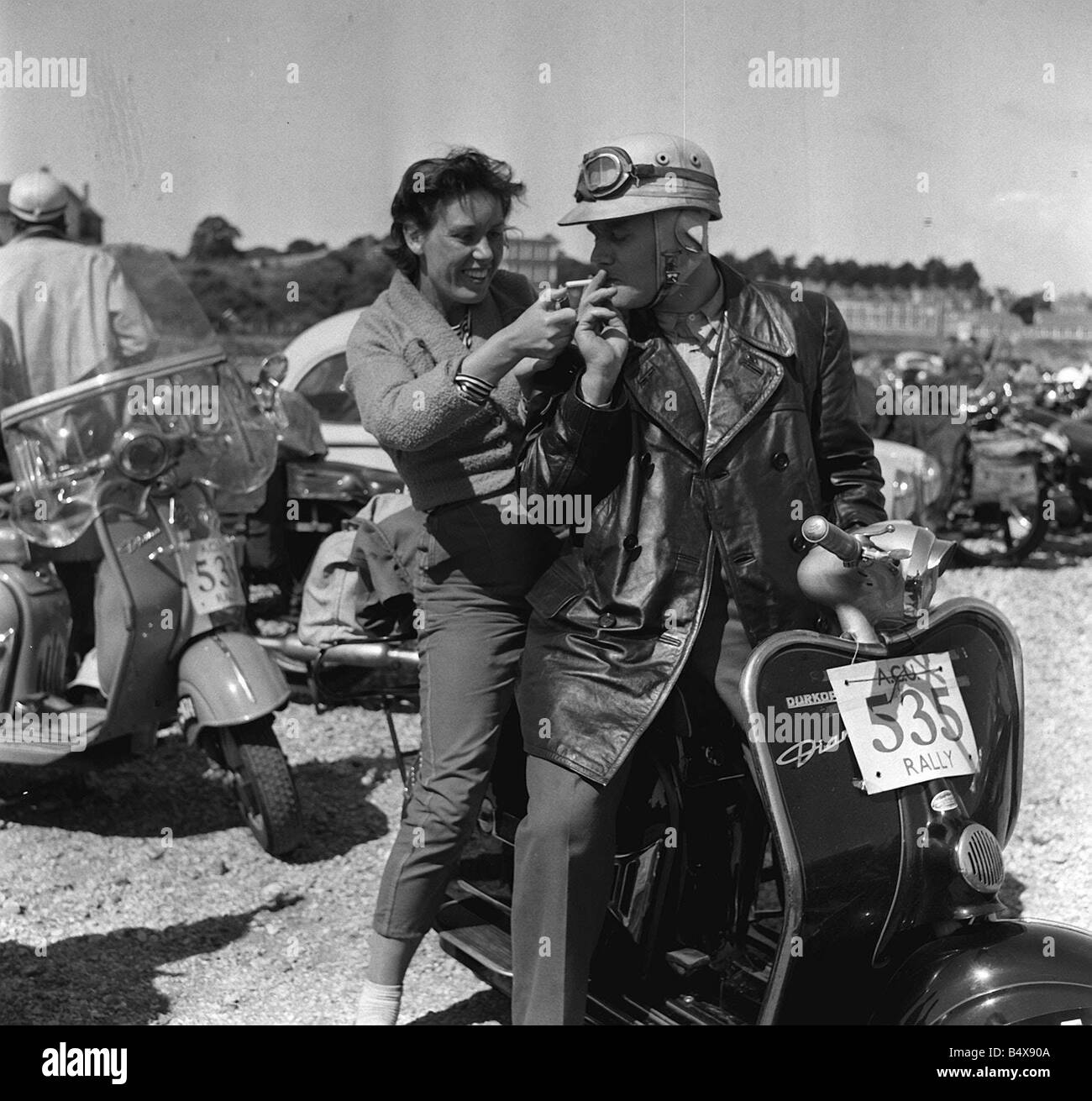 Lighting a cigarette 1950s hi-res stock photography and images - Alamy