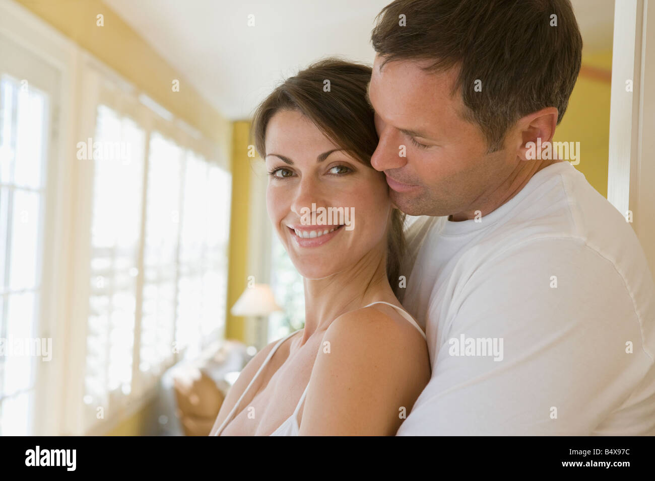 Couple hugging in the morning Stock Photo - Alamy