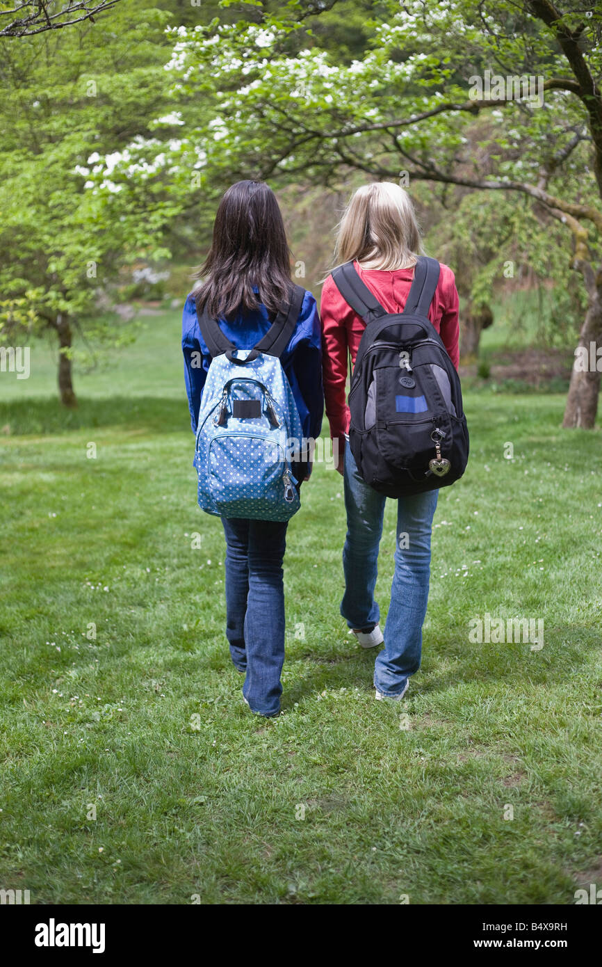 Two girls park rear view hi-res stock photography and images - Alamy