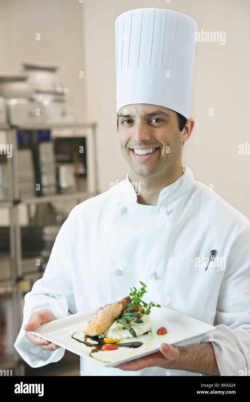 Chef presenting gourmet entree Stock Photo Alamy