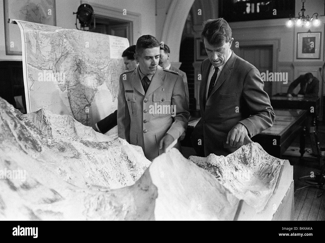 The Everest team attend a press conference at the Royal Geographical Society Kensington Gore Edmund Hillary indicates the route Stock Photo