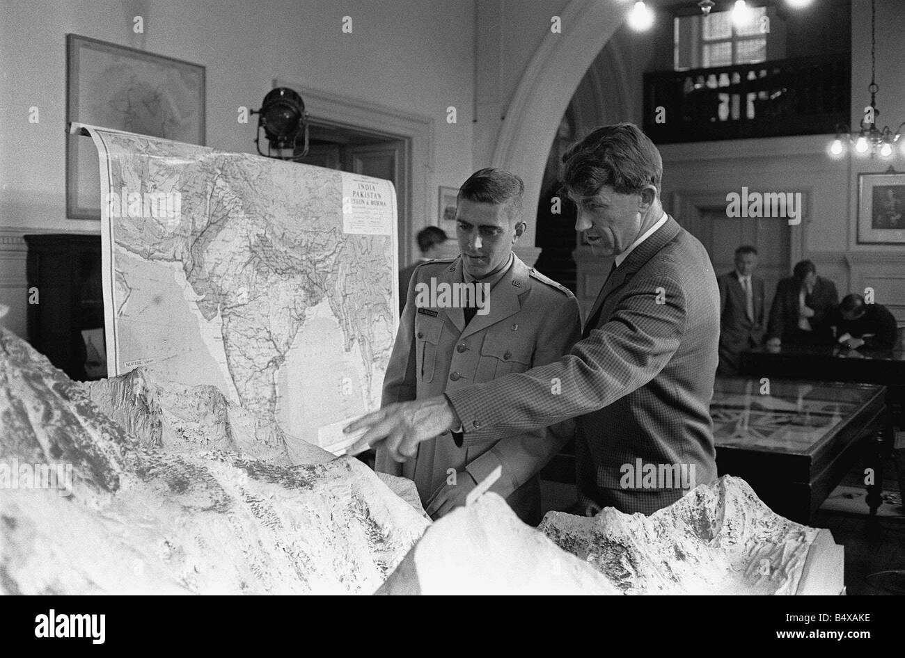 The Everest team attend a press conference at the Royal Geographical Society Kensington Gore Edmund Hillary indicates the route Stock Photo