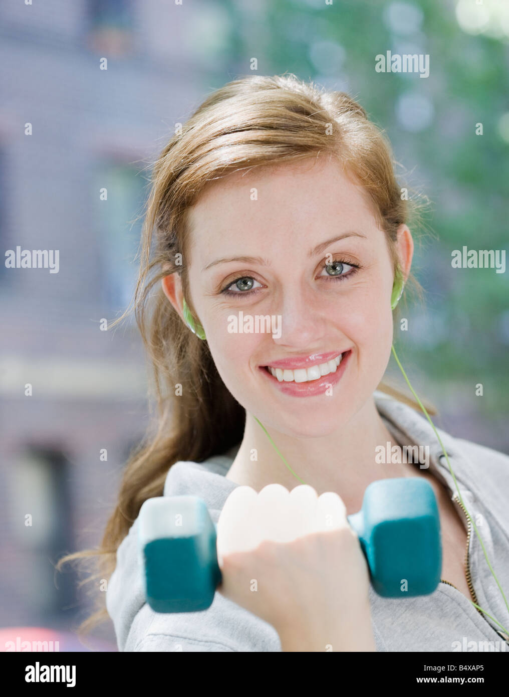 Young woman lifting hand weights Stock Photo Alamy