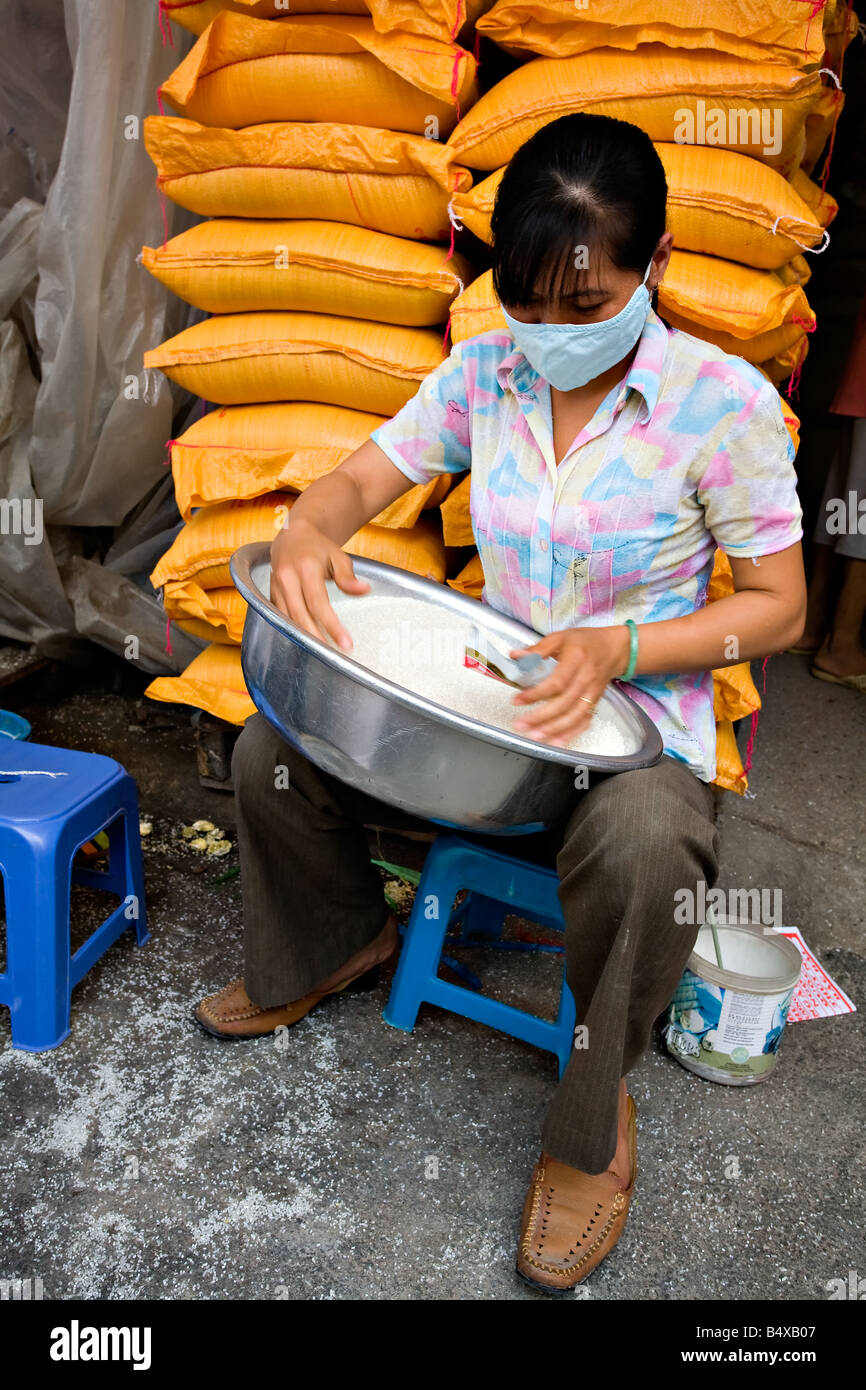 Worker sorting and cleaning rice grains Stock Photo Alamy