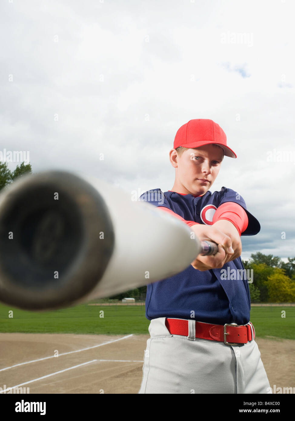 Baseball player swinging bat Stock Photo Alamy