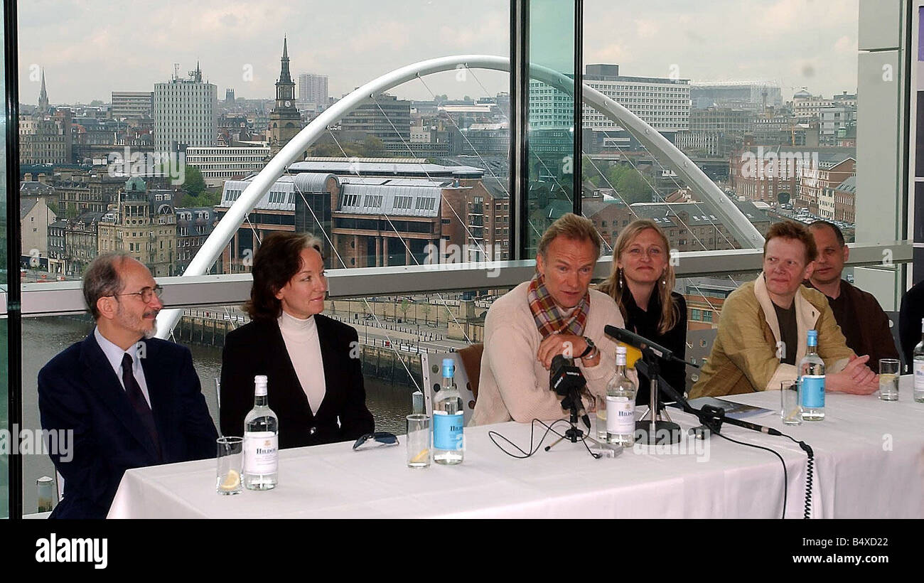 Sting centre talks at a press conference He is to join forces with the Northern Sinfonia and perform the traditional classic Waters of Tyne as part of the celebrations for the opening of the Sage building Pictured with Philippe Petit a high wire artist who will walk a tight rope across the Tyne To his left our right is Lucy Bird of the Sage next to her is Philippe Petit a high wire artist Stock Photo