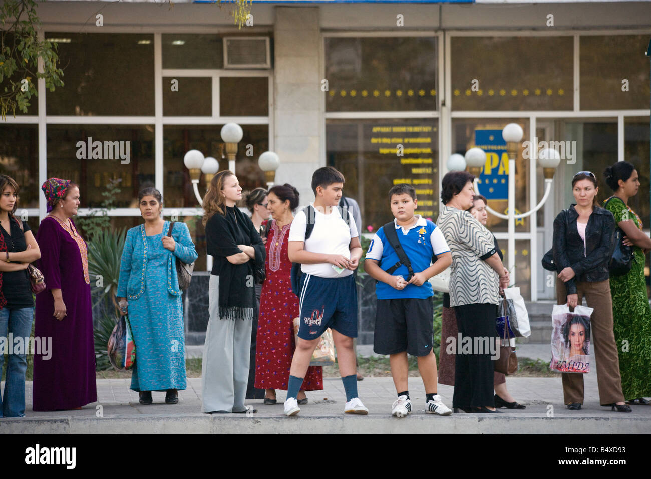 people waiting at bus stop, Ashgabat, Turkmenistan Stock Photo