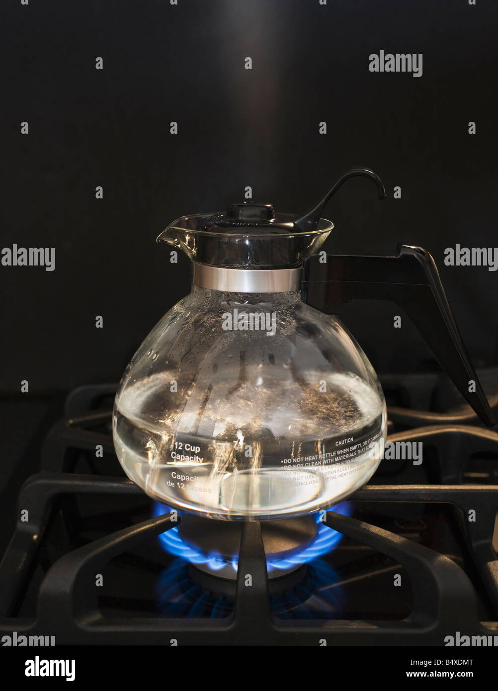 Close up of water boiling on stove Stock Photo Alamy