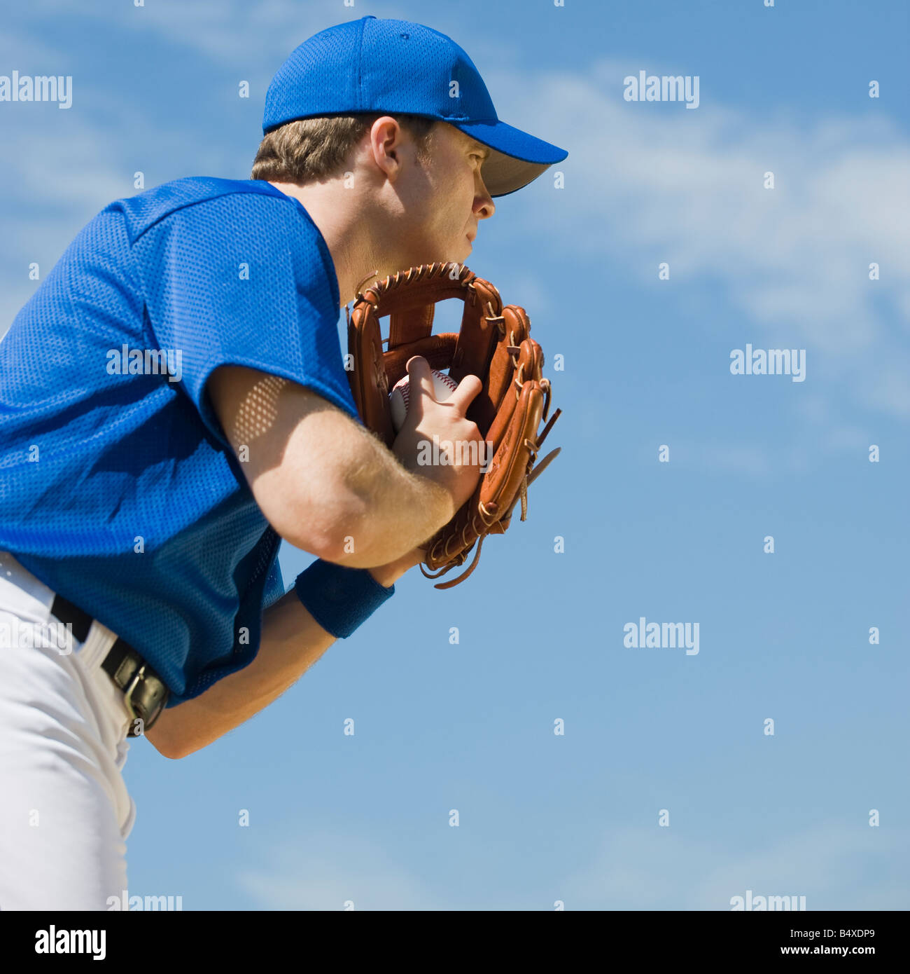 Baseball pitcher preparing to pitch ball Stock Photo Alamy