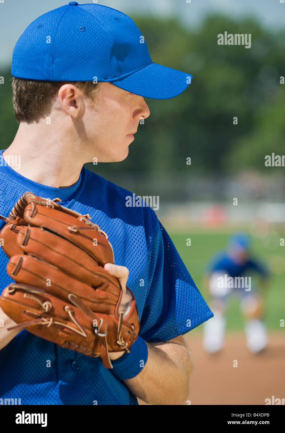Baseball pitcher preparing to pitch ball Stock Photo Alamy