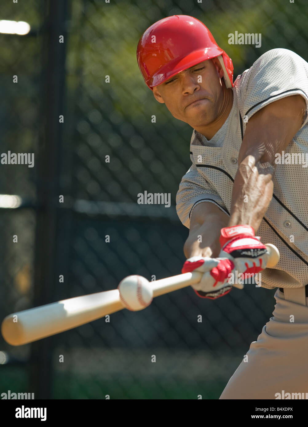 Baseball batter hitting ball Stock Photo - Alamy
