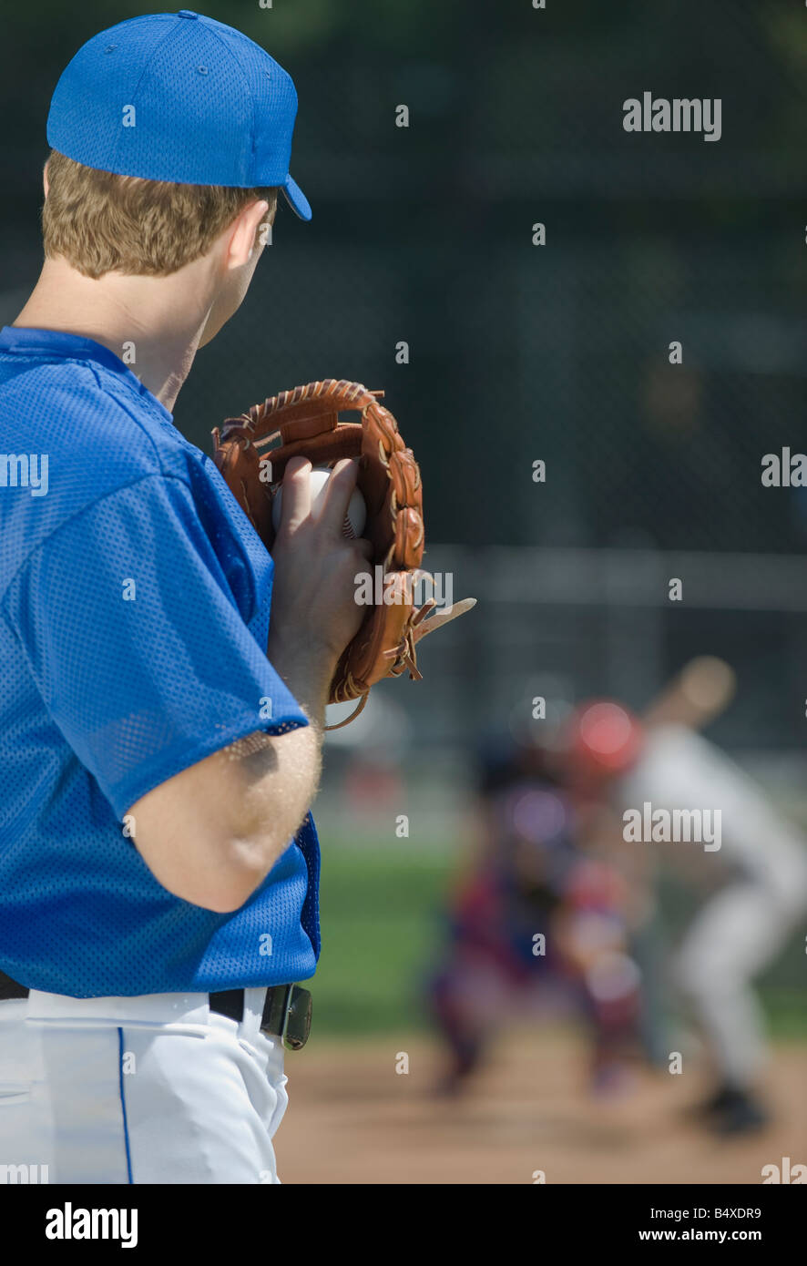 Baseball pitcher preparing to pitch ball Stock Photo Alamy
