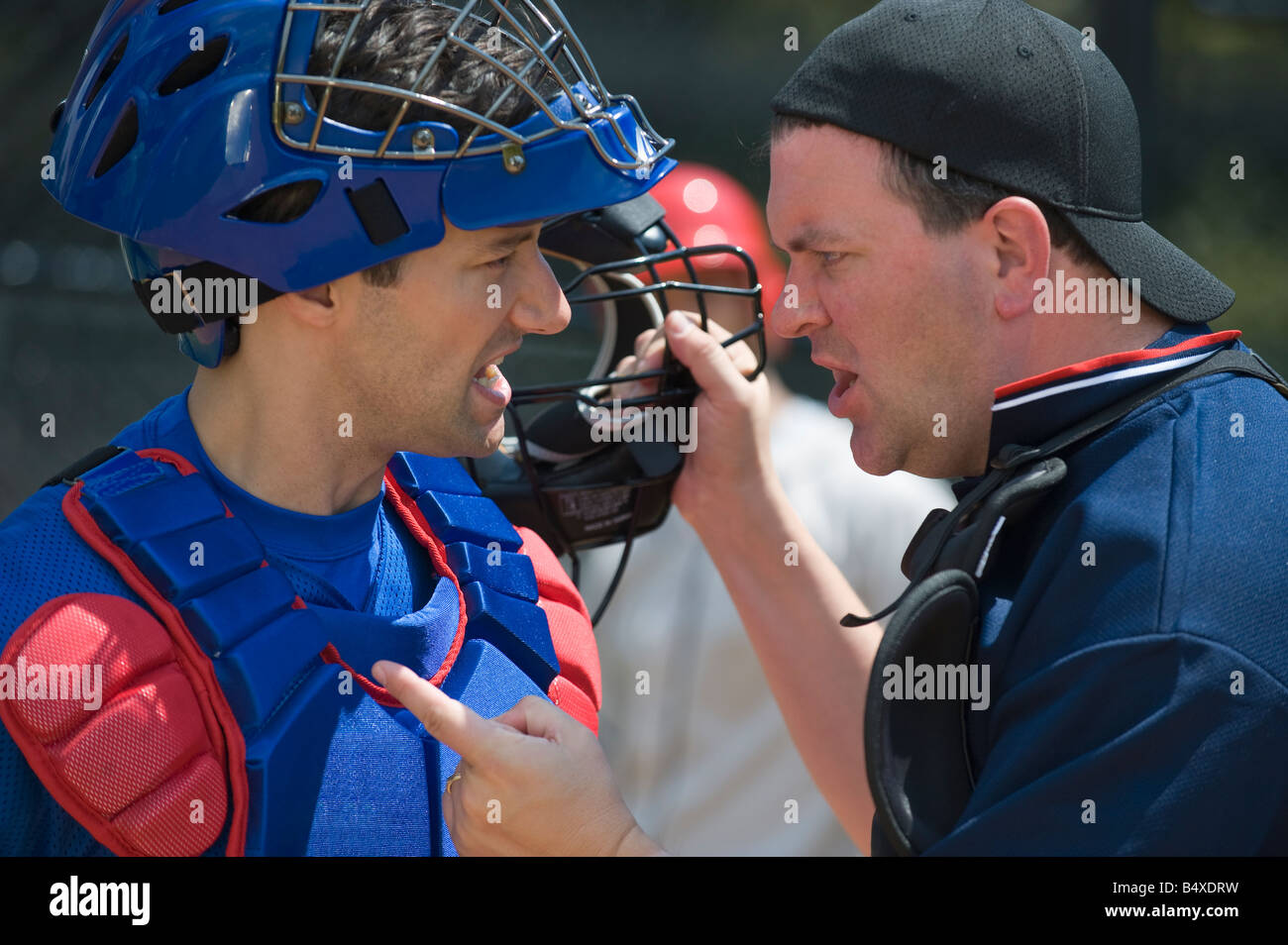 Baseball catcher arguing with umpire Stock Photo Alamy