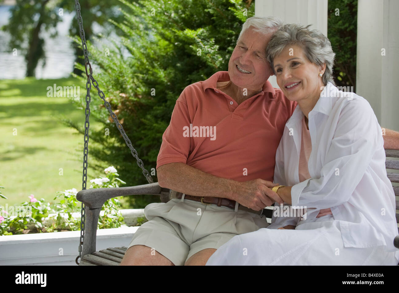 Senior couple sitting on porch swing Stock Photo Alamy