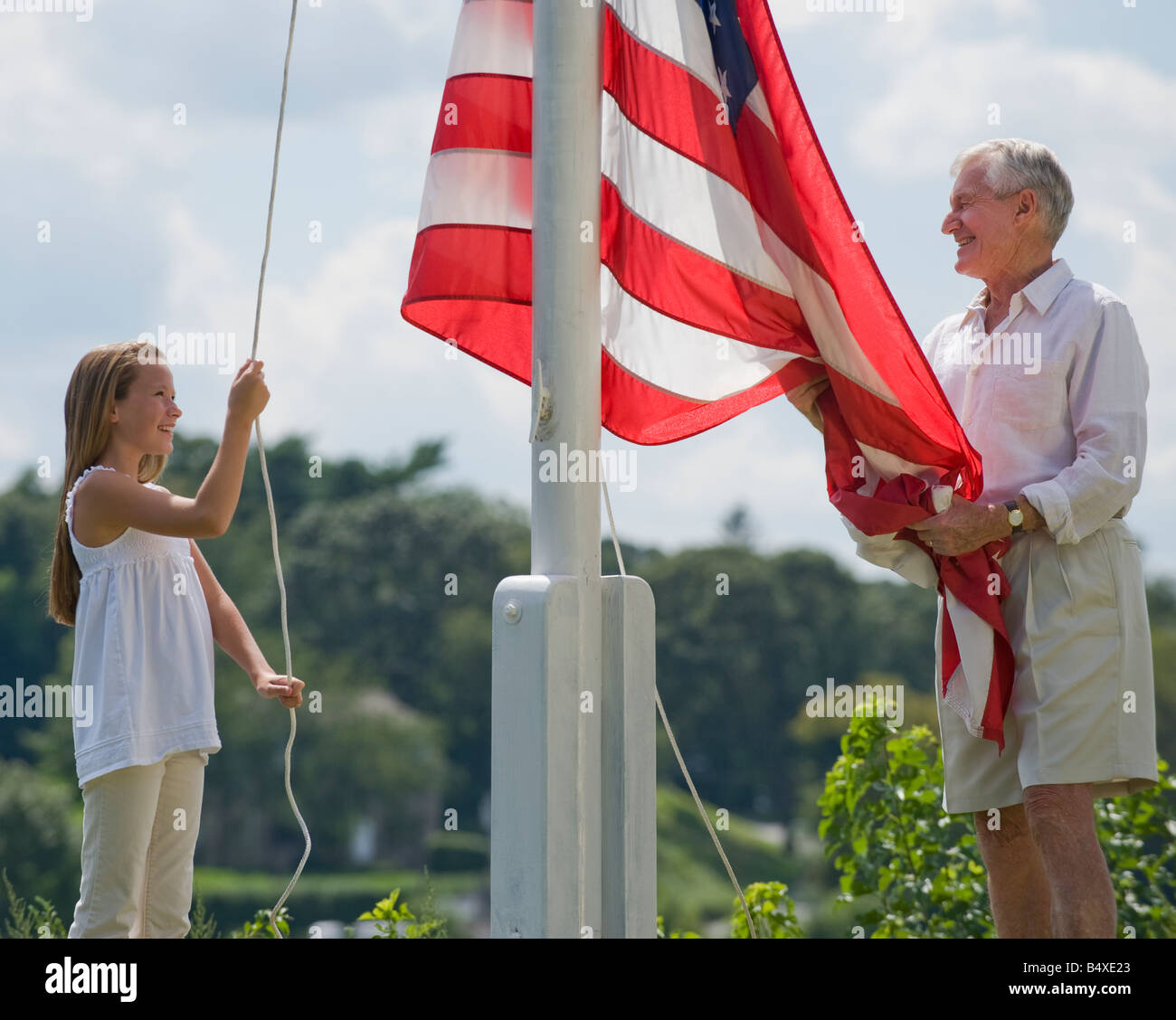 Raising flag rope hi-res stock photography and images - Alamy