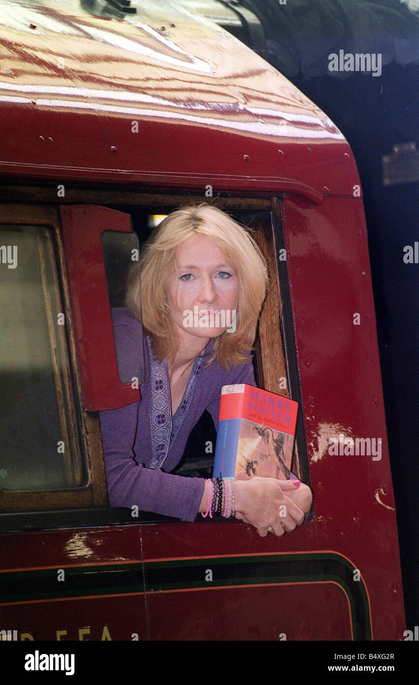 J K Rowling Author leans out of a steam train named Hogwarts Express at Kings Cross railway station in London holding her fourth book in the popular children s Harry Potter series Harry Potter and the Goblet of Fire This train appears in the Potter book with the new title going on sale across the world at Saturday Stock Photo