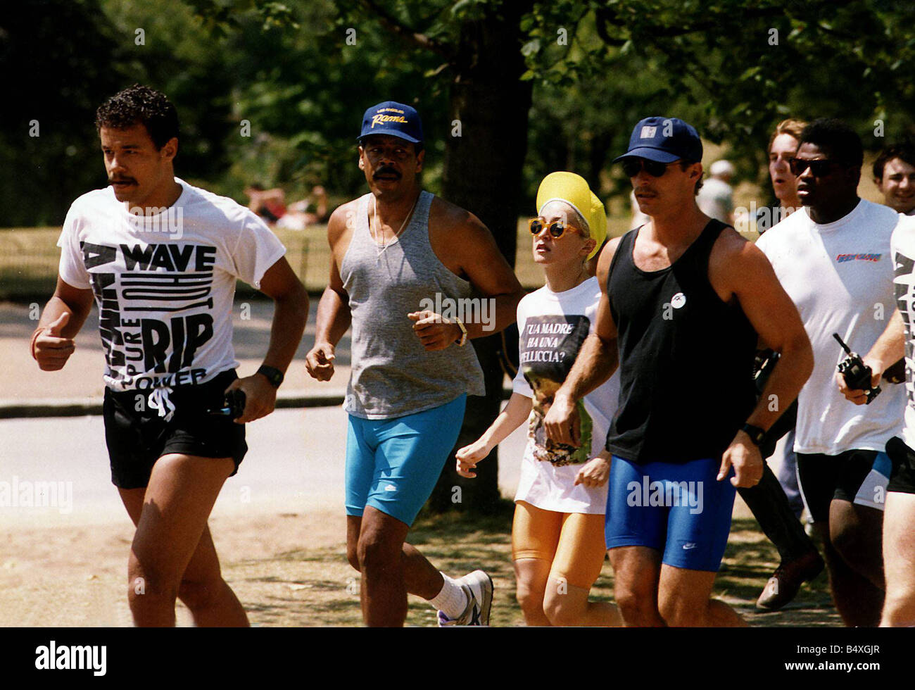 Madonna Pop Singer goes running with her eight minders in Hyde Park Stock Photo