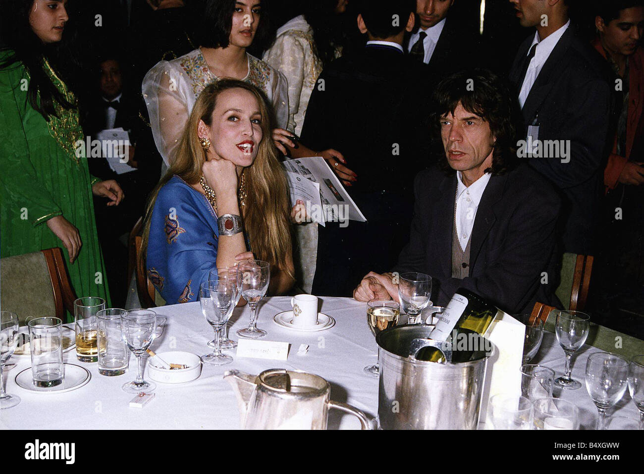 Mick Jagger Singer with wife Jerry Hall sitting at table a gala night Stock Photo