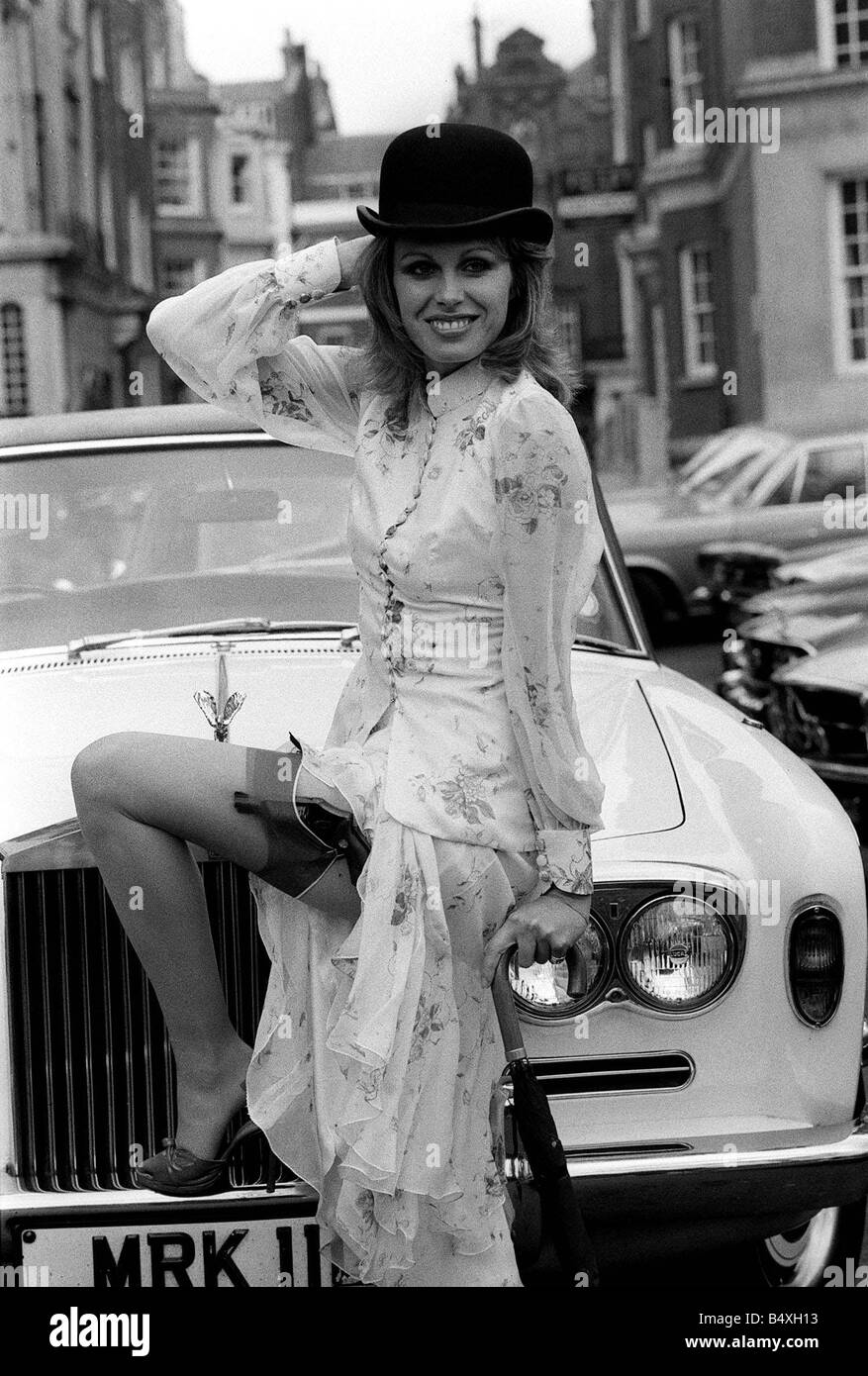 Joanna Lumley stars as Purdy in New Avengers 1976 poses in front of Silver shadow Rolls Royce motor car wearing bowler hat Stock Photo