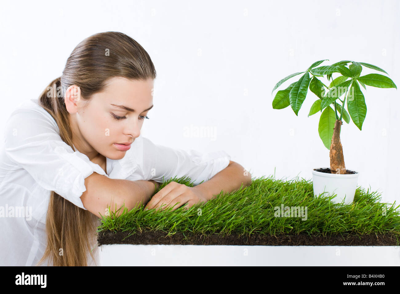young woman with potted plant Stock Photo