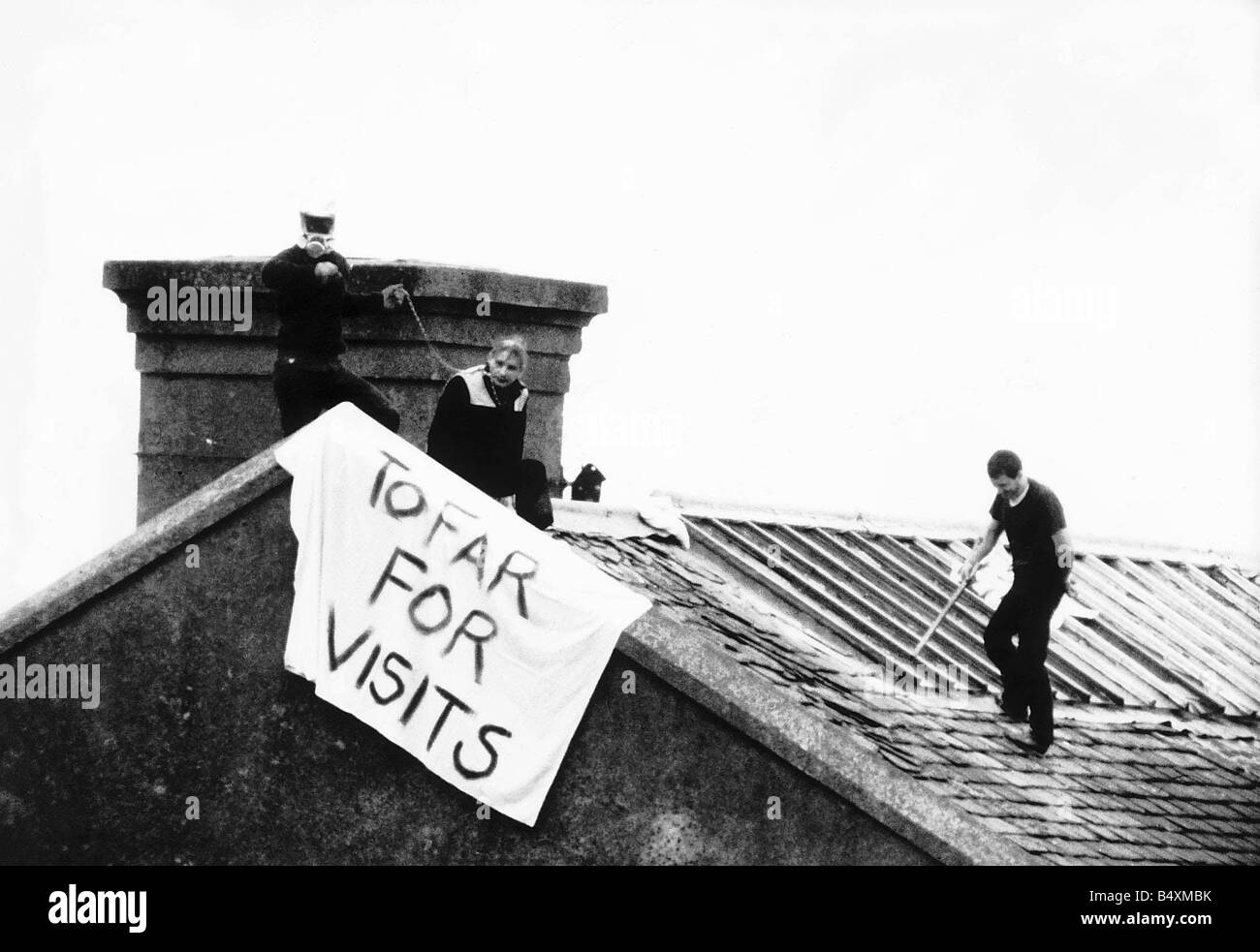 Peterhead Prison riots October 1987 prisoners on the roof after prison officer Jackie Stewart was taken hostage banner to far for visits Stock Photo
