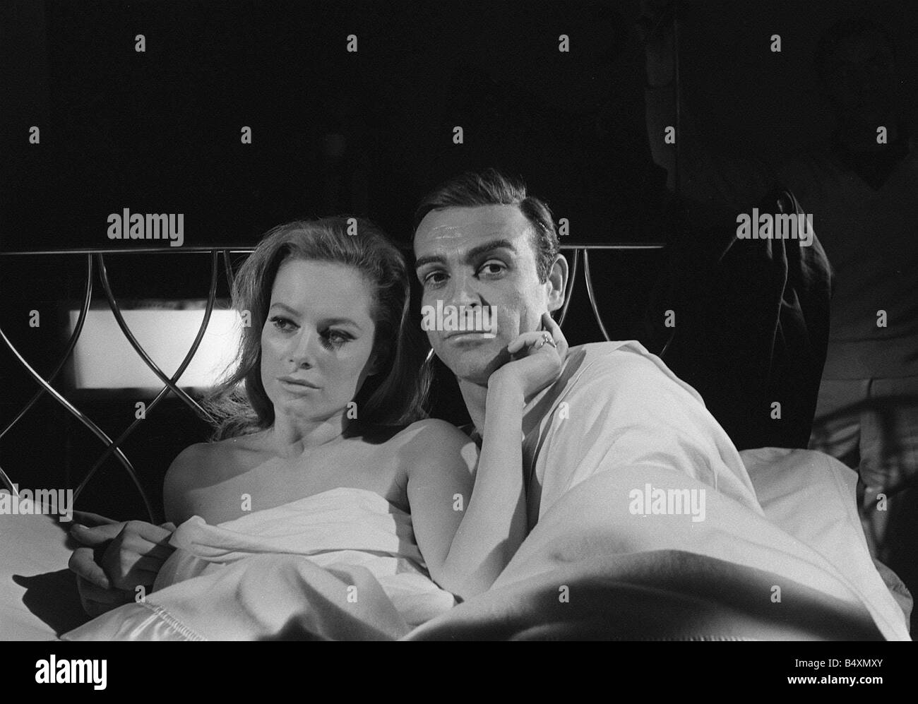 Film Thunderball 1965 Sean Connery and Luciana Paluzzi Filming bed scene James Bond 007 James Bond Girl Stock Photo