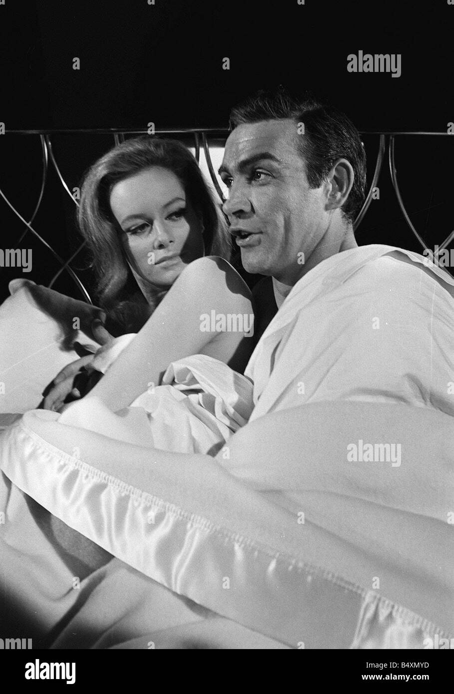 Film Thunderball 1965 Sean Connery and Luciana Paluzzi Filming bed scene James Bond 007 James Bond Girl Stock Photo