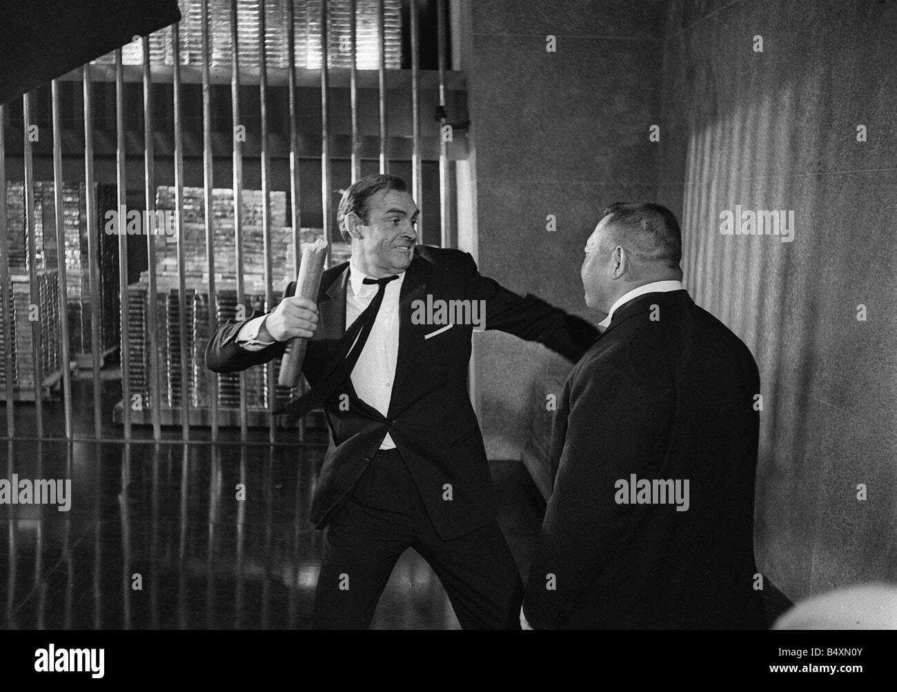 Film Goldfinger 1964 Sean Connery as James Bond 007 fighting with Goldfinger s henchman Odd Job in the vault at Fort Knox Stock Photo